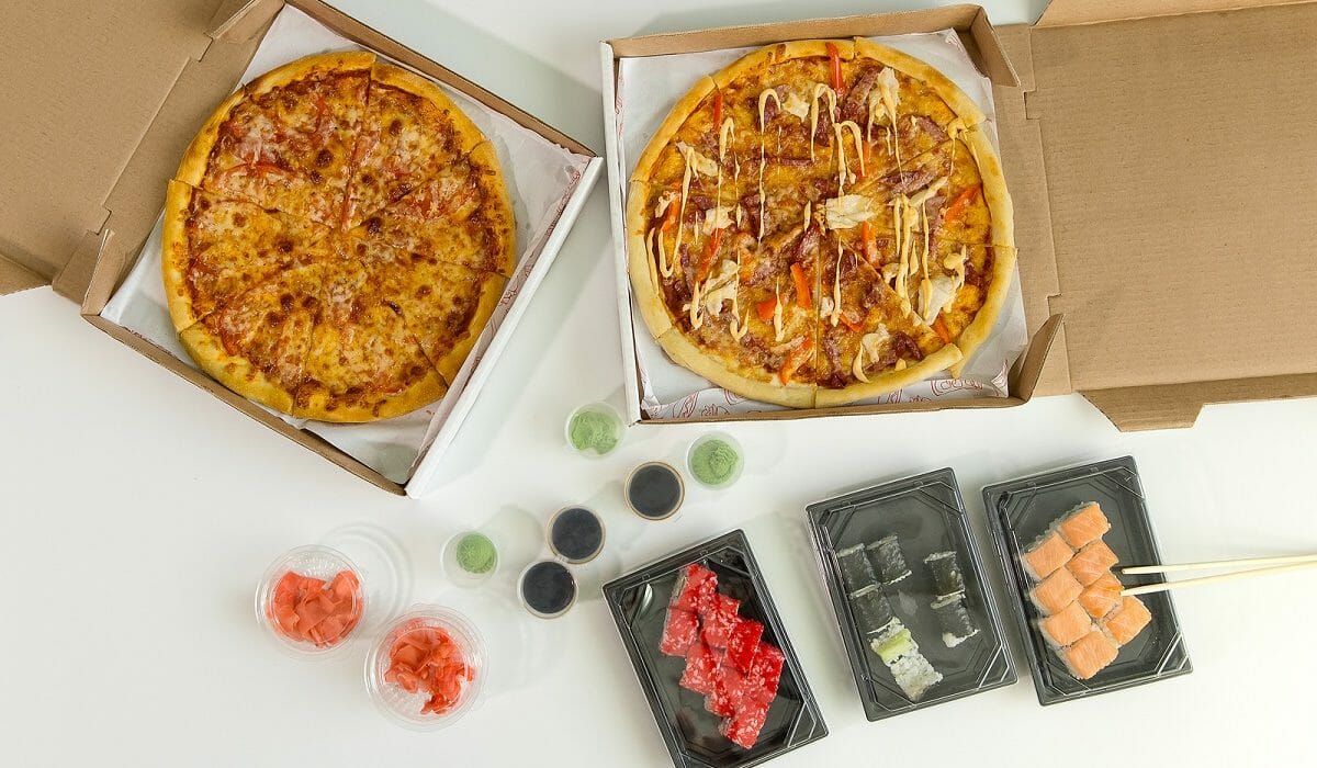 Sushi And Pizza. Concept Of Business Lunch, White Background. Ca Why Does IIFYM Give So Many Calories?